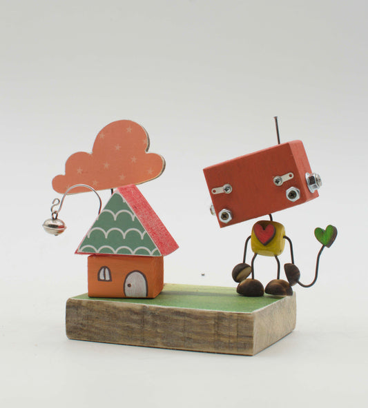 Diorama scultura luminosa stile robot fatta a mano con figurina rossa, testa quadrata, occhi a bulloni e cuore giallo