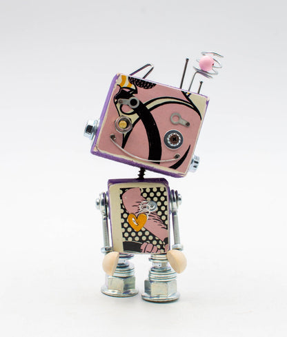 Lampada di cortesia robot giocattolo rosa e nero in stile retrò con arti metallici a molla e piedi beige in legno