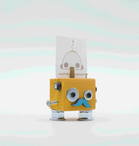 Portafoto da tavolo robot in legno giallo con occhi a vite argento e basette blu in carta, gambe metalliche handcrafted