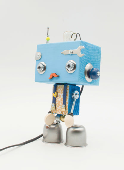 Robot lampada da tavolo beat in legno blu con occhi metallici baffi e piedi a campana fatta a mano