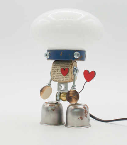 Graziosa lampada creata con forma di robot tavolo stile fanale bianca con collarino blu e piedi a campana metallici